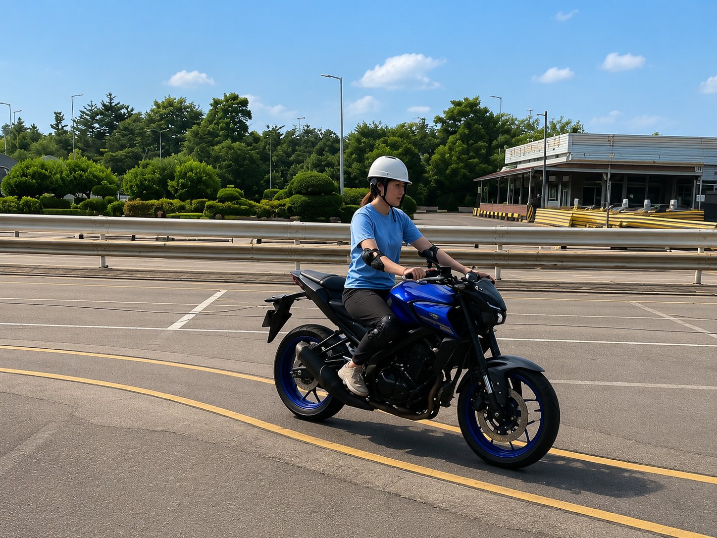 Student practising motorcycle slalom in full safety gear at the SDA circuit